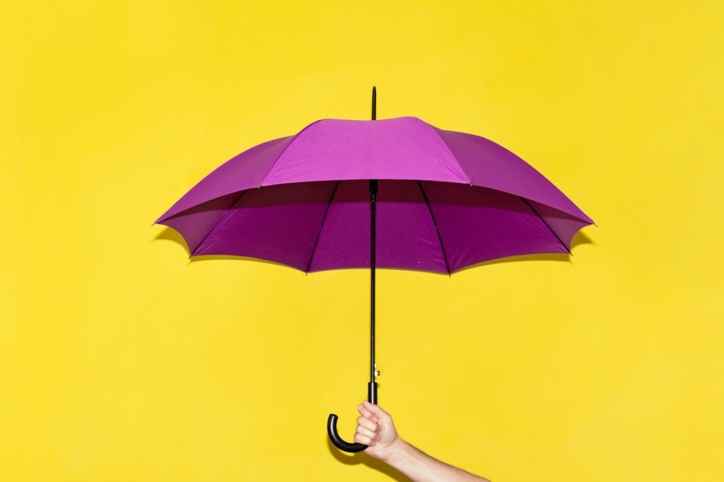 Holding An Umbrella