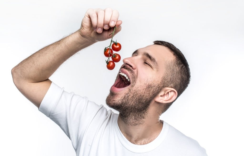 Eating A Tomato